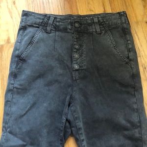 Gray denim jeans with a button fly